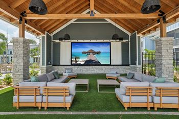 A wooden outdoor theater with a screen and seating. at The Junction at Rockledge Apartments, Rockledge, FL, 32955